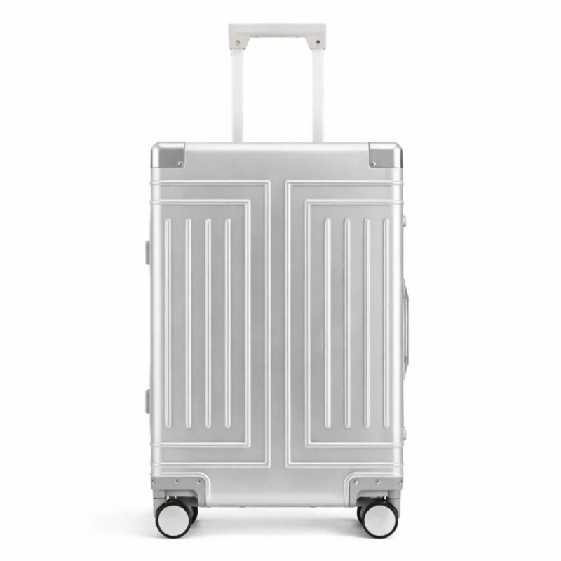 Valise rigide en aluminium argenté avec poignée télescopique et roulettes. Design moderne et pratique, idéale pour les voyages.